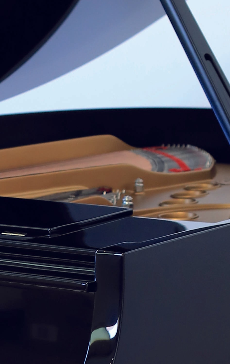 A restored Steinway & Sons Teague Model grand piano in a stunning black polyester finish.