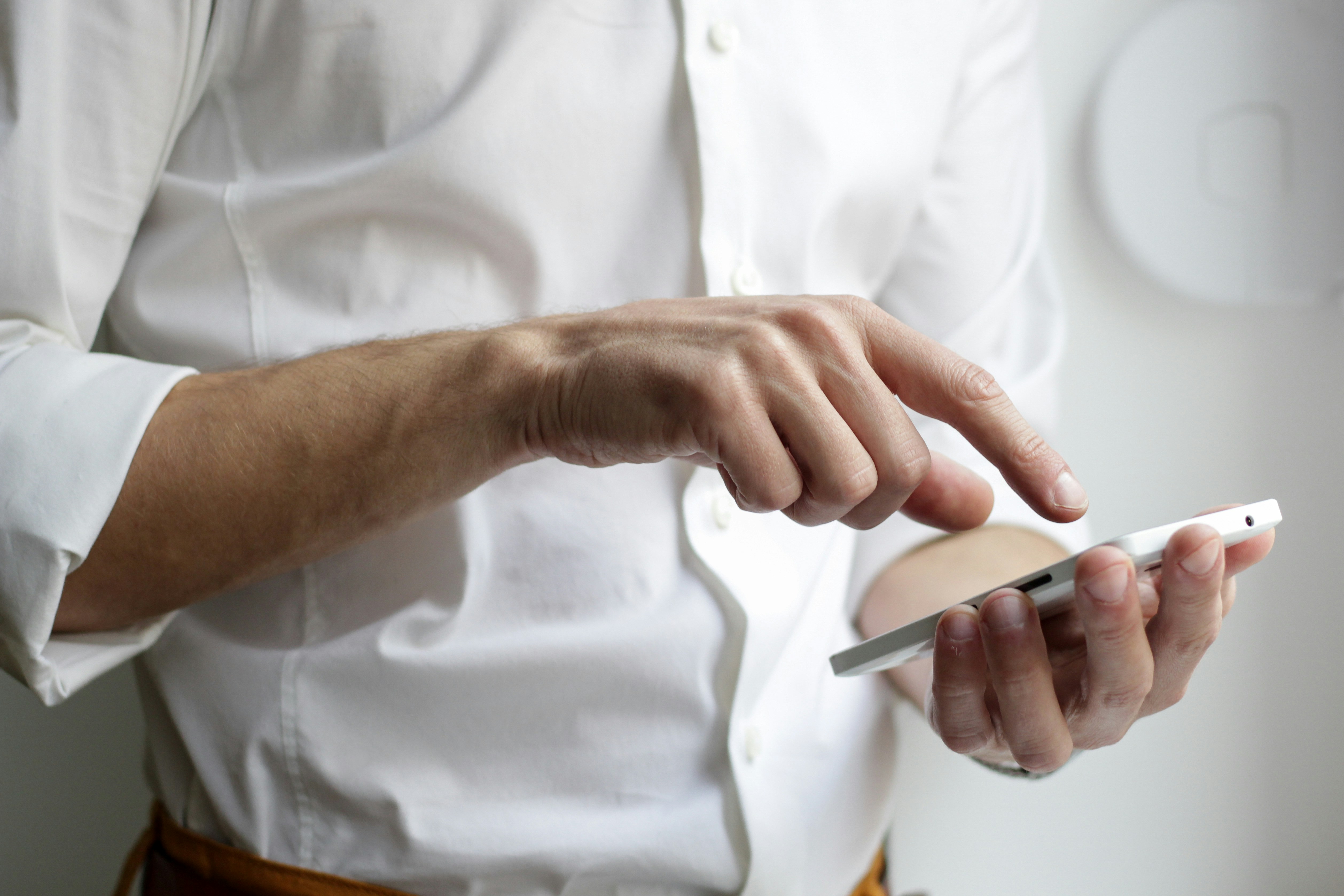 Person Touching Smartphone - WellSaid Labs Alternative