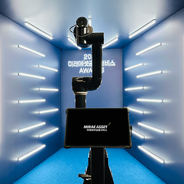 Minimalist brushed-steel chair in a white corner studio—industrial, brutalist modern furniture.