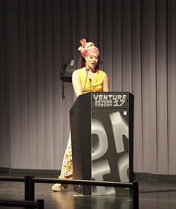 A woman talking to the public from the stand