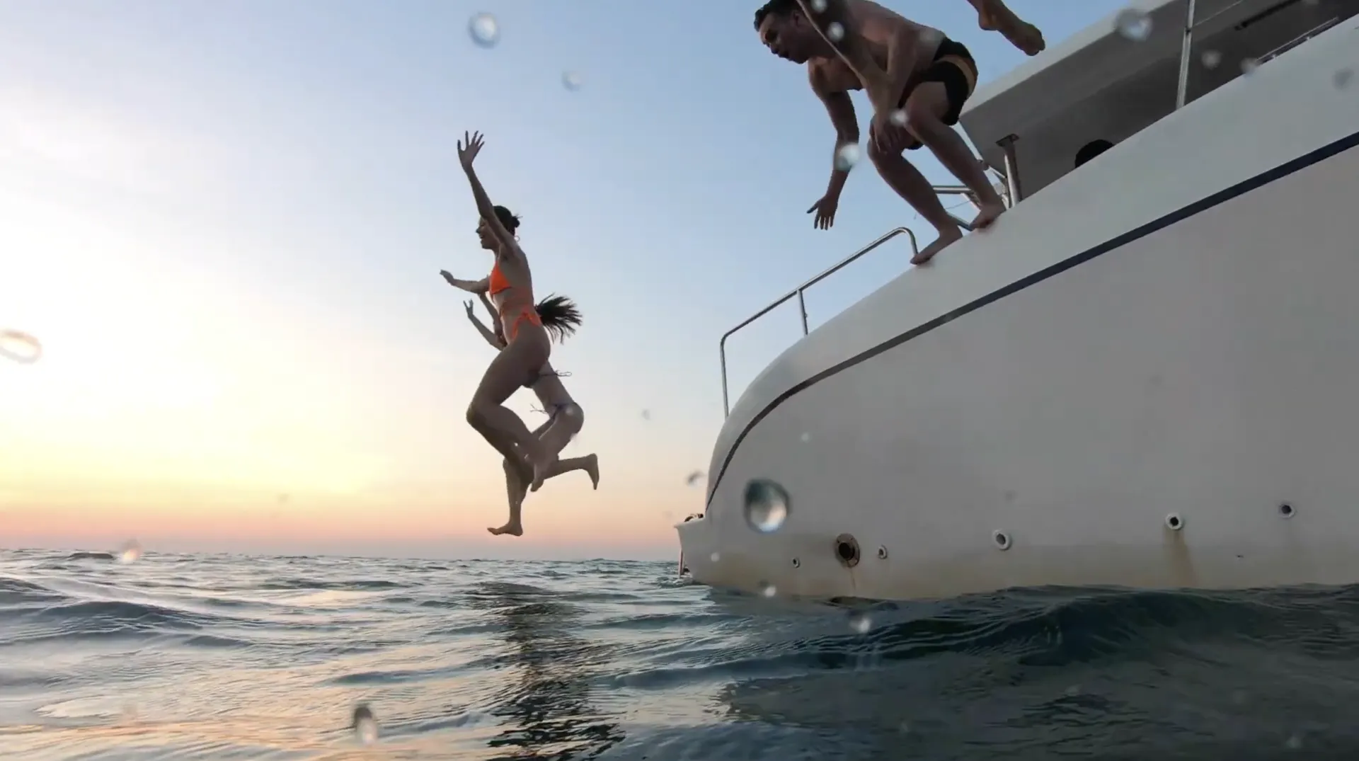 Travellers Jumping Into Pool