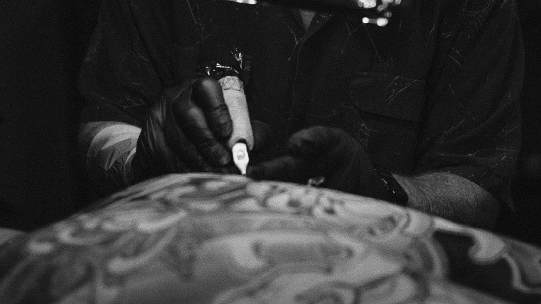 George Bardadim at work, tattoo-artist in Brooklyn, NY