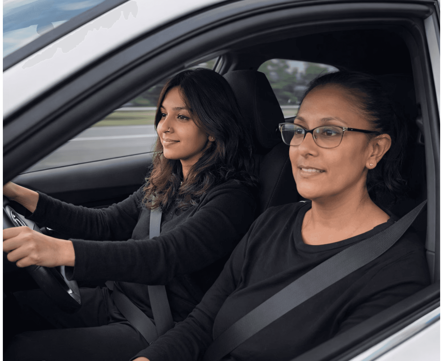 Auto-Learners student sitting in the driver’s seat of a car