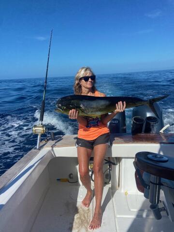 Woman holding Dolphin (Mahi Mahi)