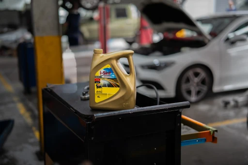 Mechanic at Ideal using Lubricant