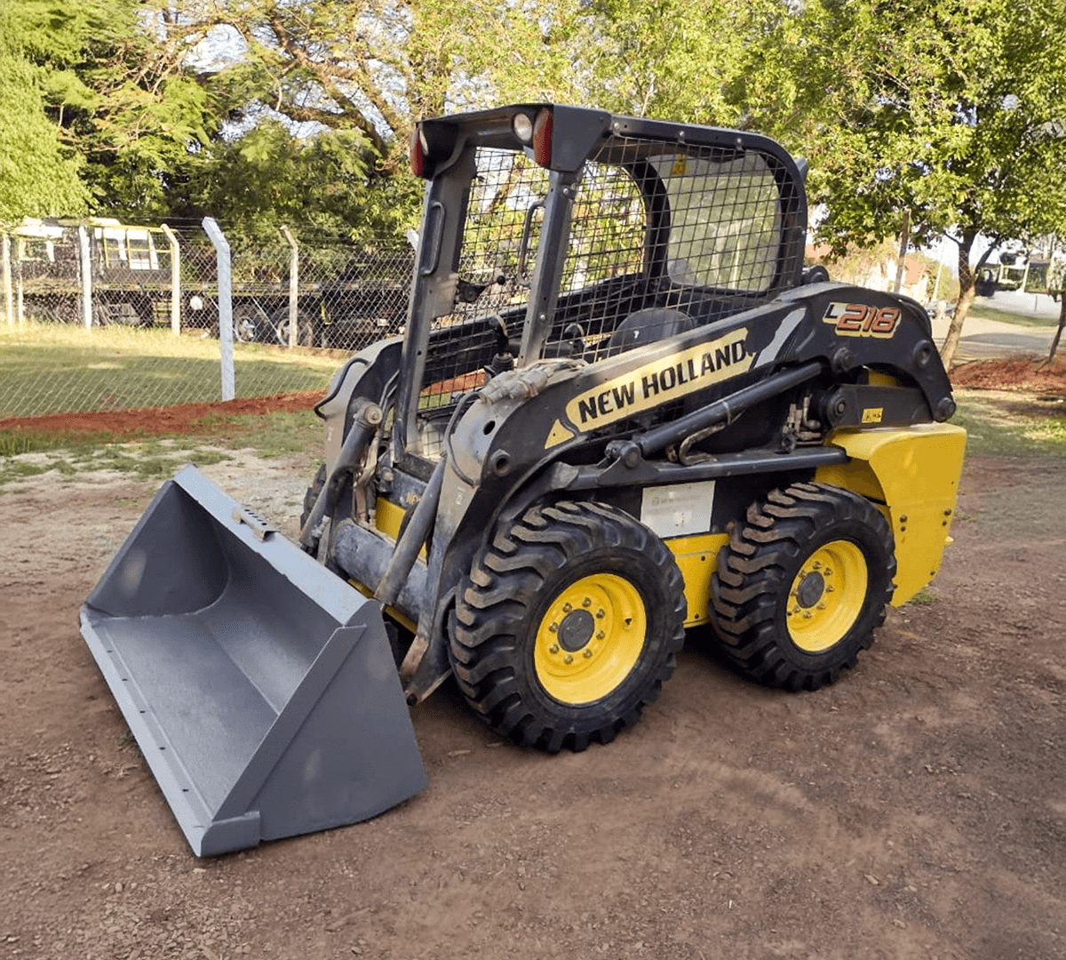 Two happy corgis sitting on a chair.
