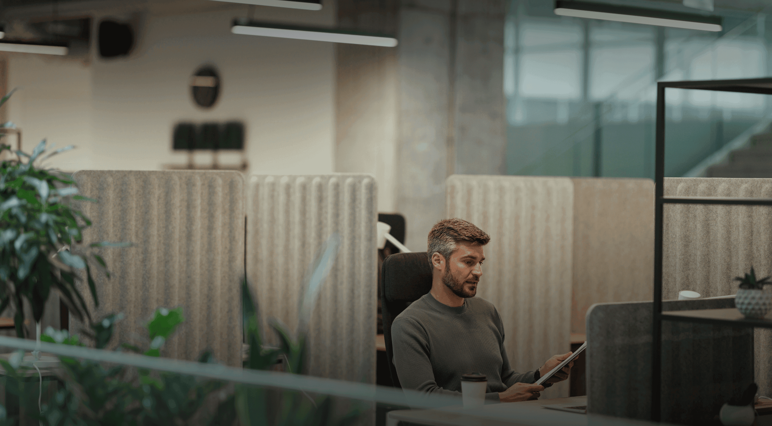 Businessman sitting in his office looking at the computer