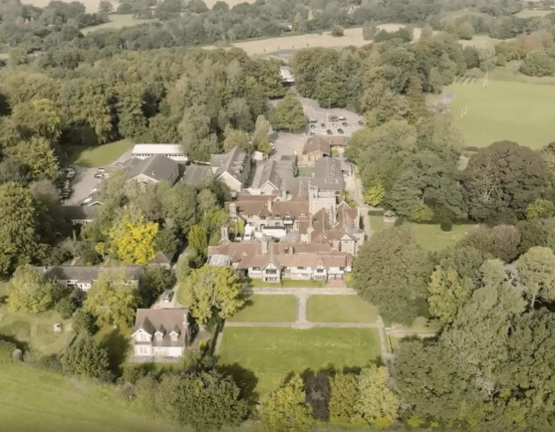aerial photography of person trimming sports field during day