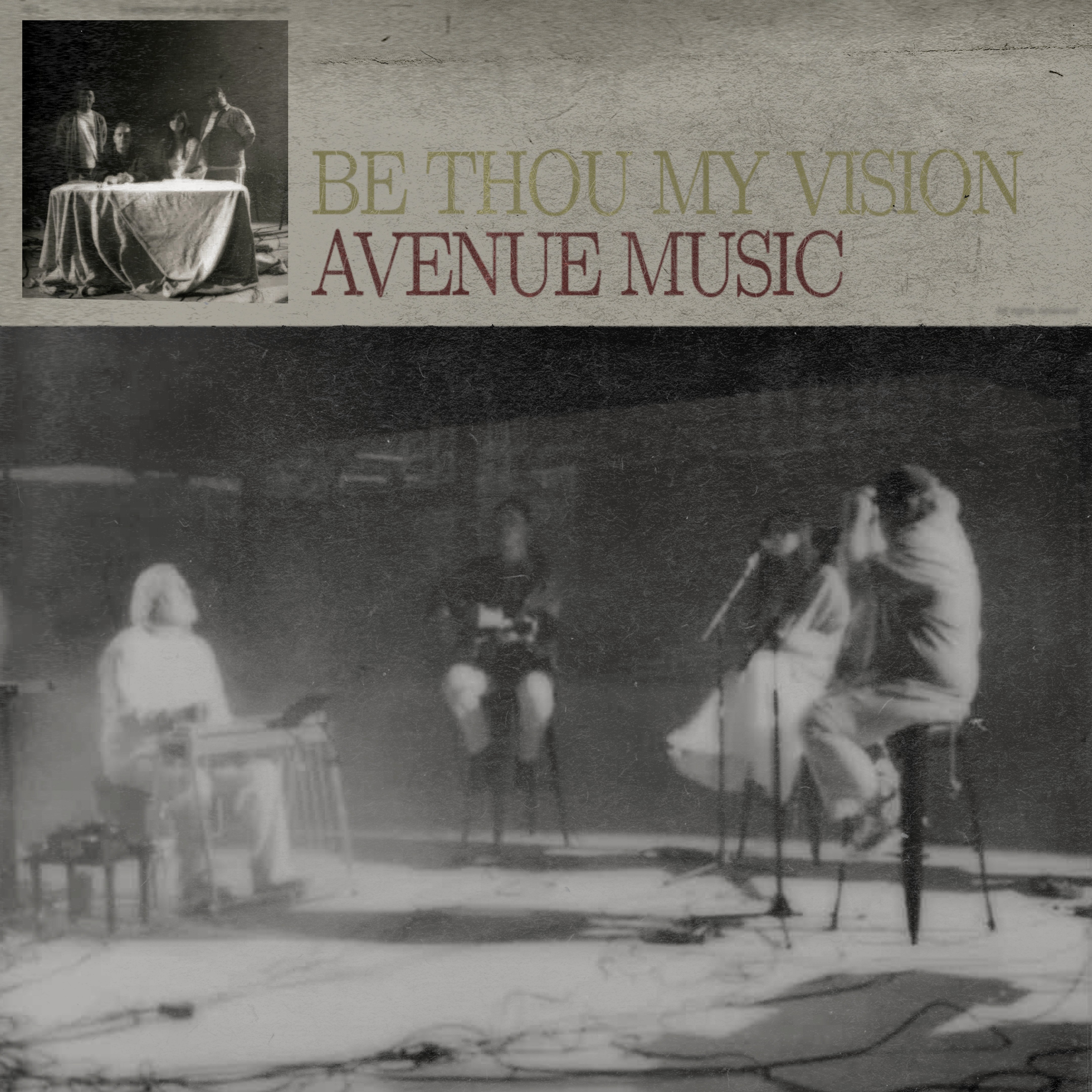 A performer sits at a piano under a single spotlight in a darkened space, creating an intimate atmosphere.