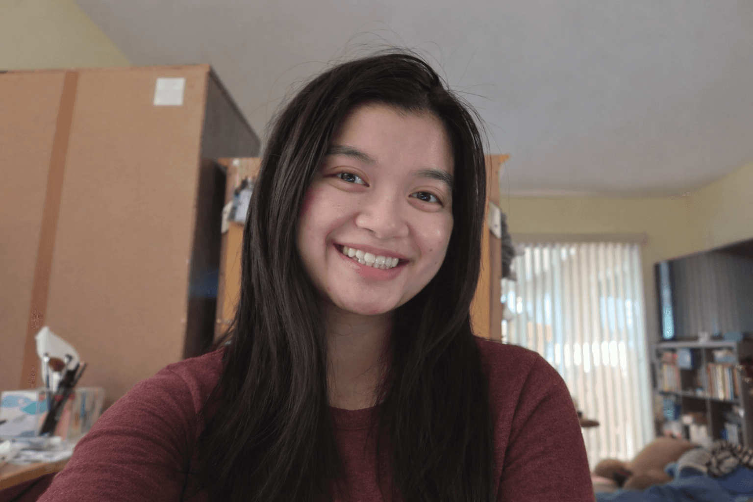 A young girl smiling