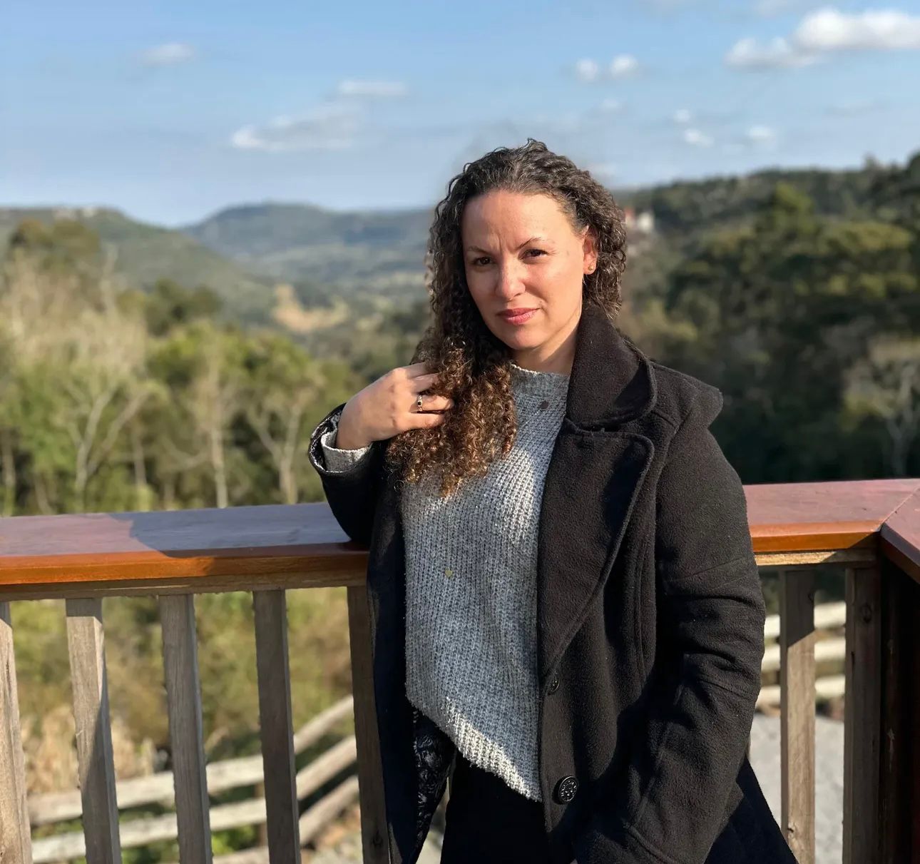 A happy customer smiling wearing orange headband