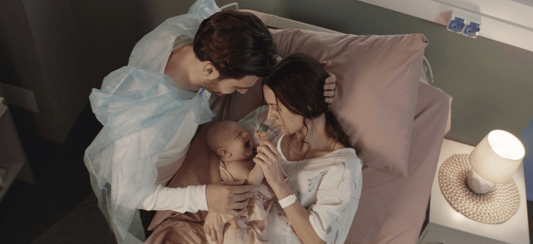 Three people talking in a modern office