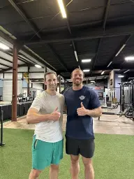 man in black hoodie standing