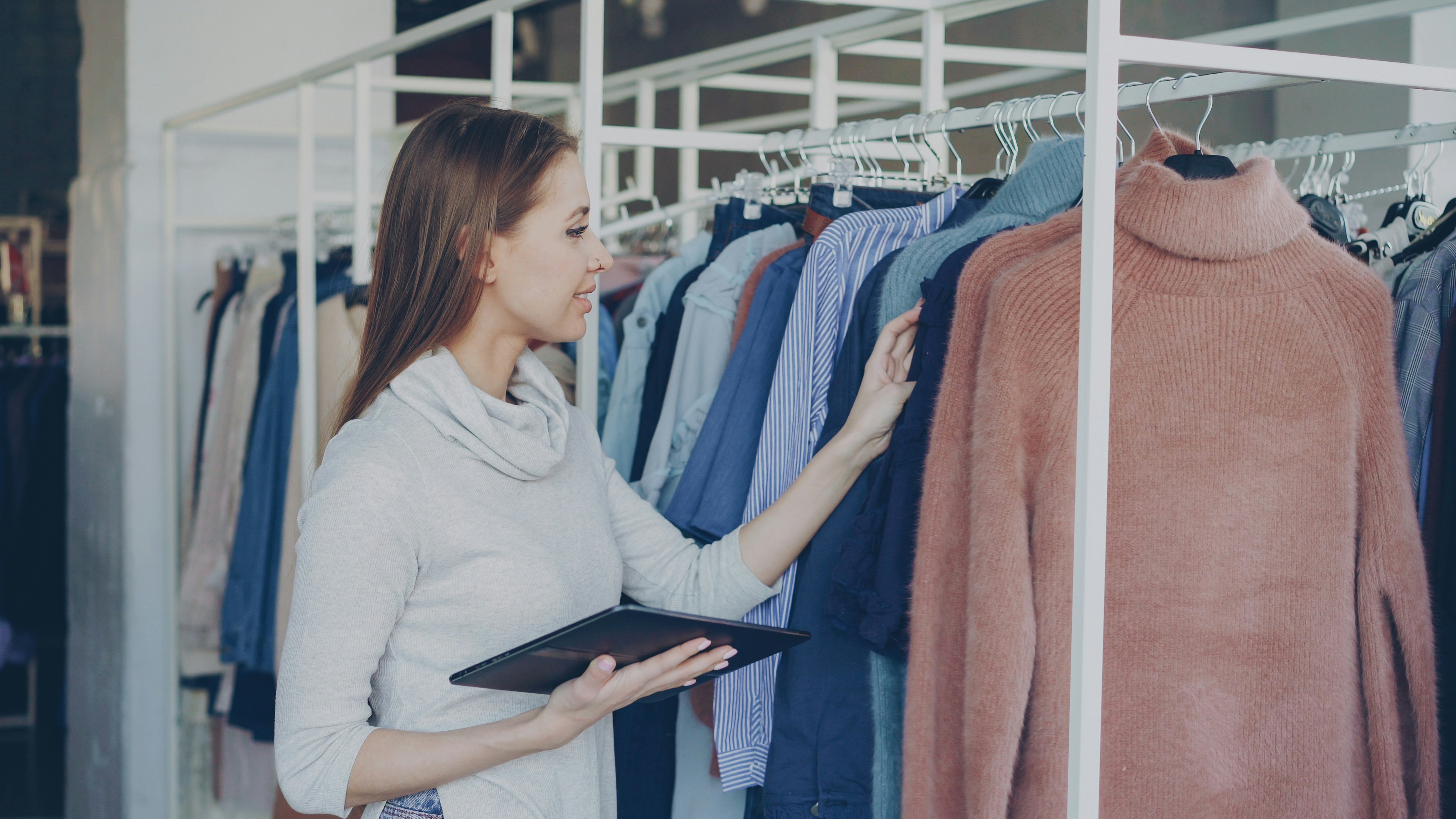 Woman shopping for clothes in a boutique.