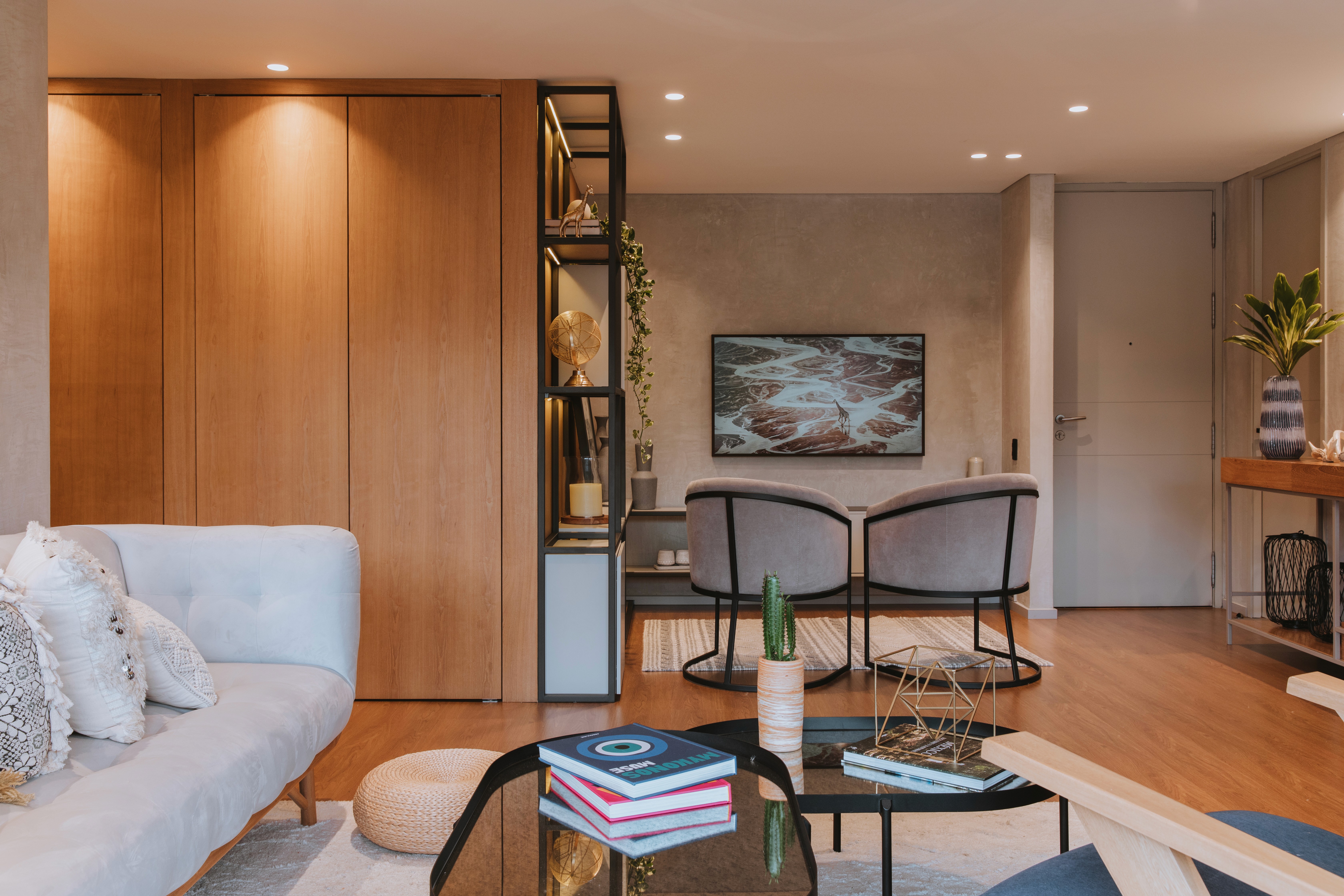 Double-height interior with flowing sculptural forms and warm raking light