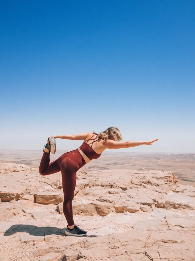 Woman stretching outdoors in warm light