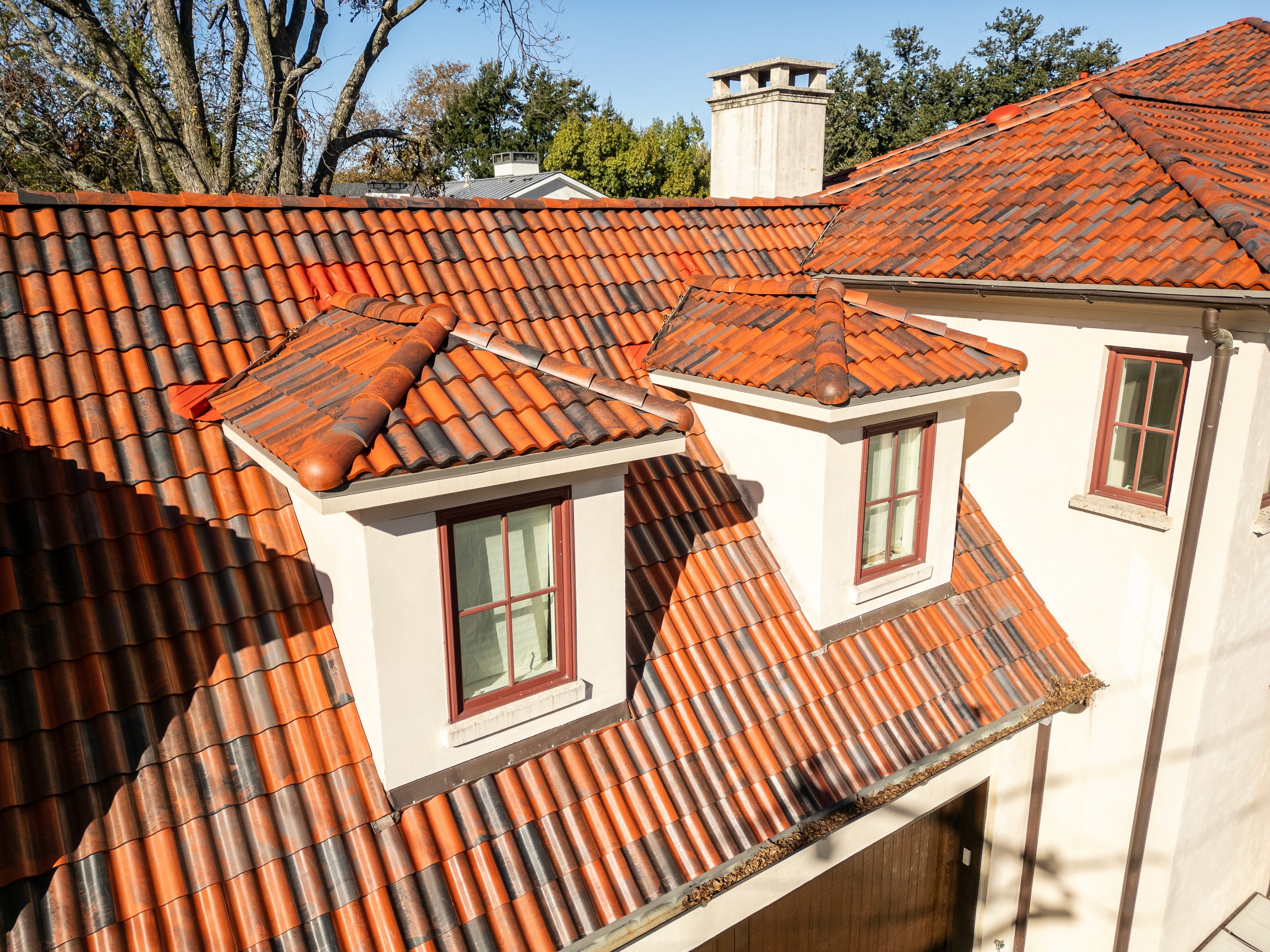 Close-up of red clay barrel tile on a University Park residential roof