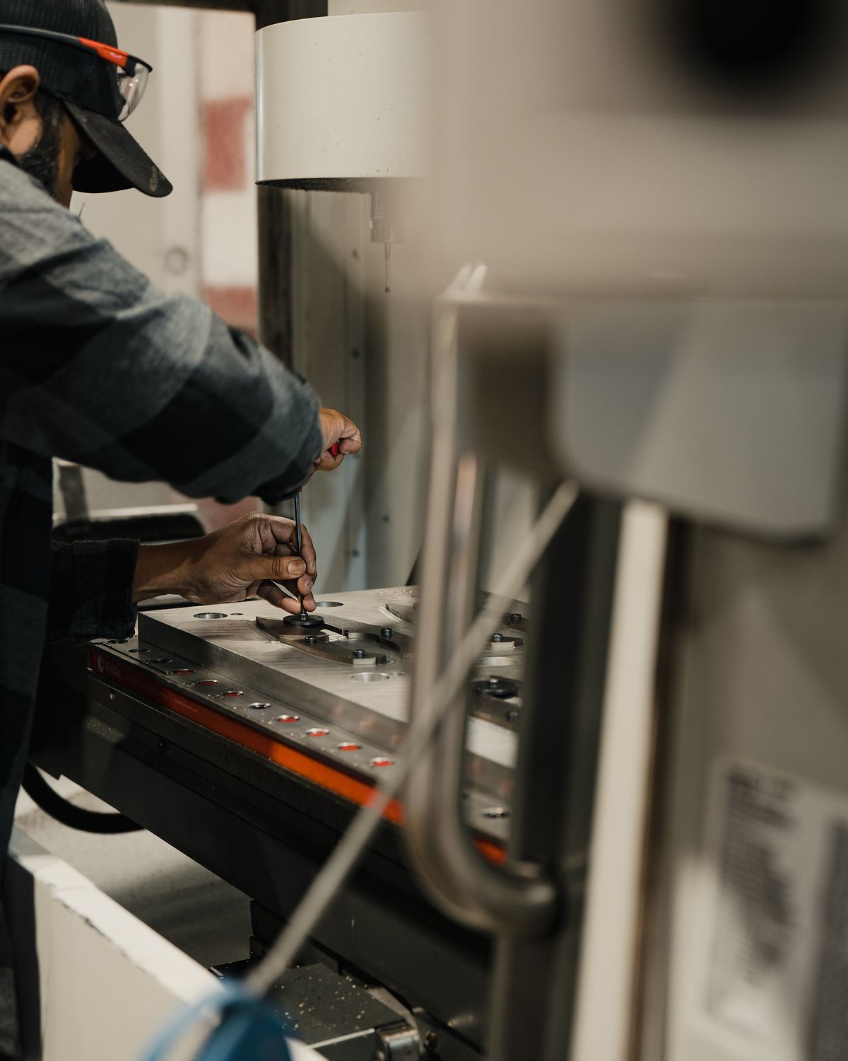 Laptop on a clean desk next to modern decor.