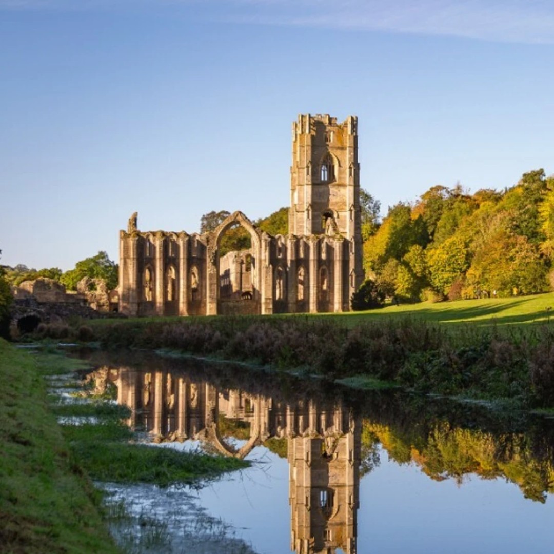 An image of Fountains Abby being reflected in the river.