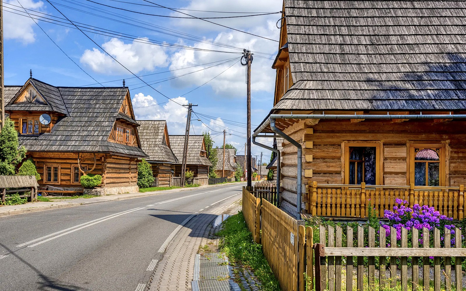 Traditional wooden houses along a street in Zakopane, Poland.