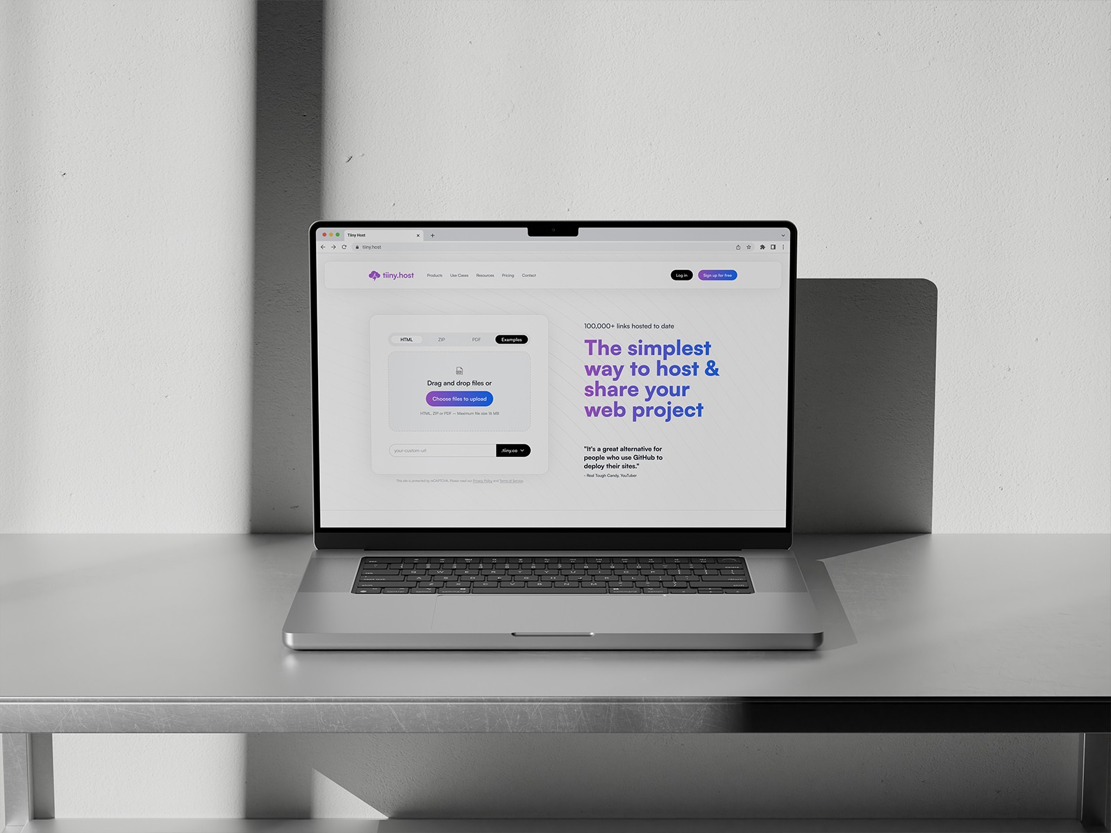 Laptop displaying a landing page for hosting service Tiiny Host
