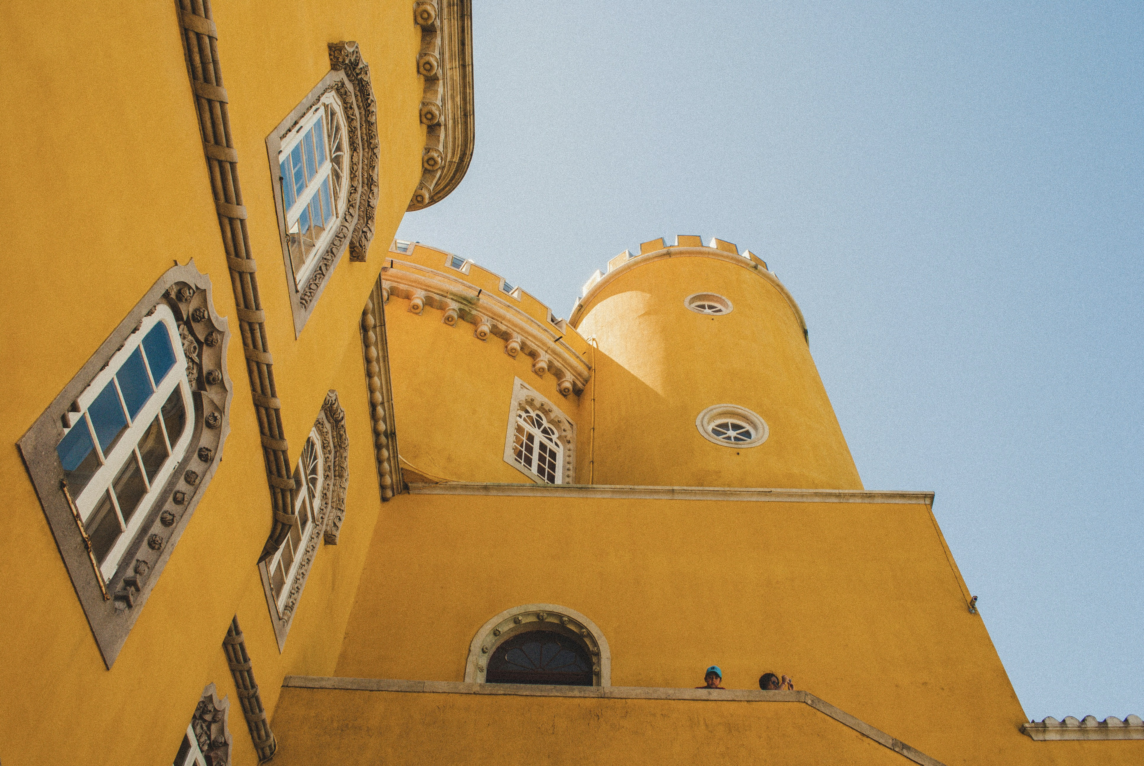 Rooftop views over historic Portugal at sunset, highlighting slow, multigenerational travel through culture, architecture, and coastal life.