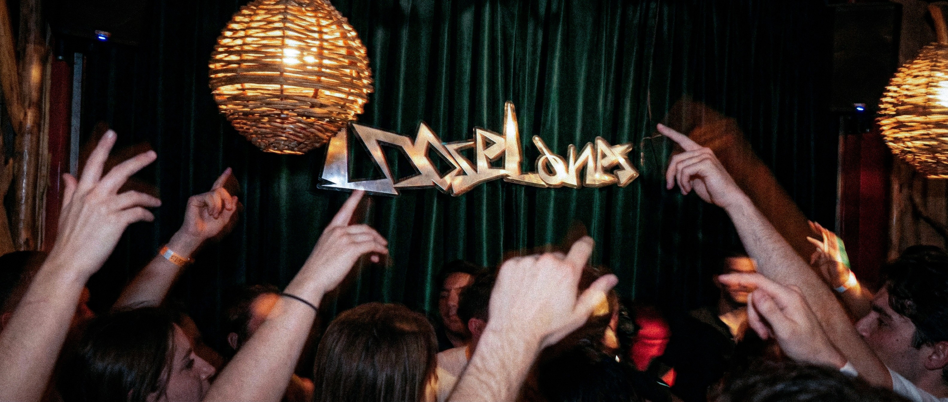 LooseLanes suspended logo installation above crowd during house music event