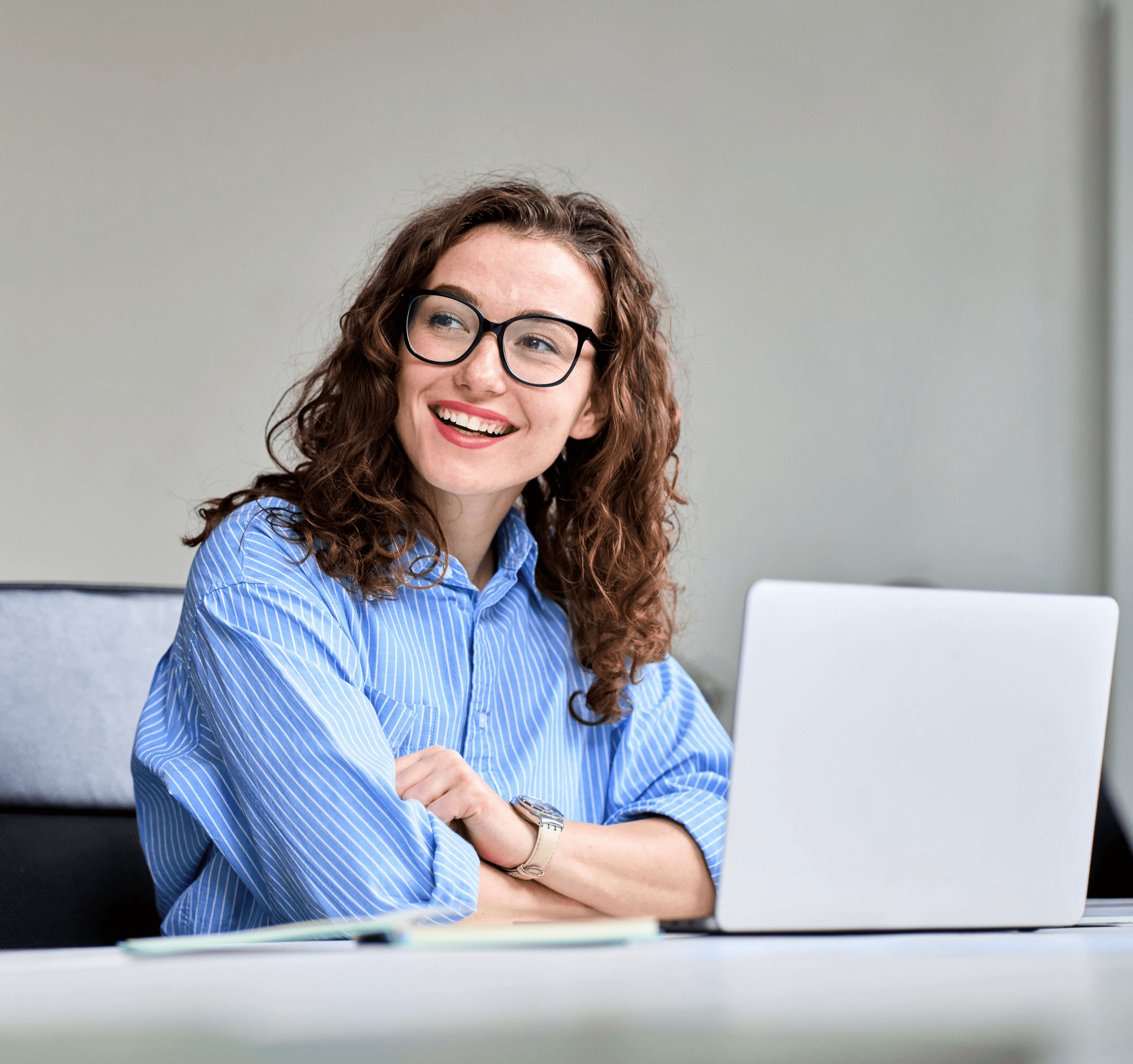 People working at computers in a modern office.