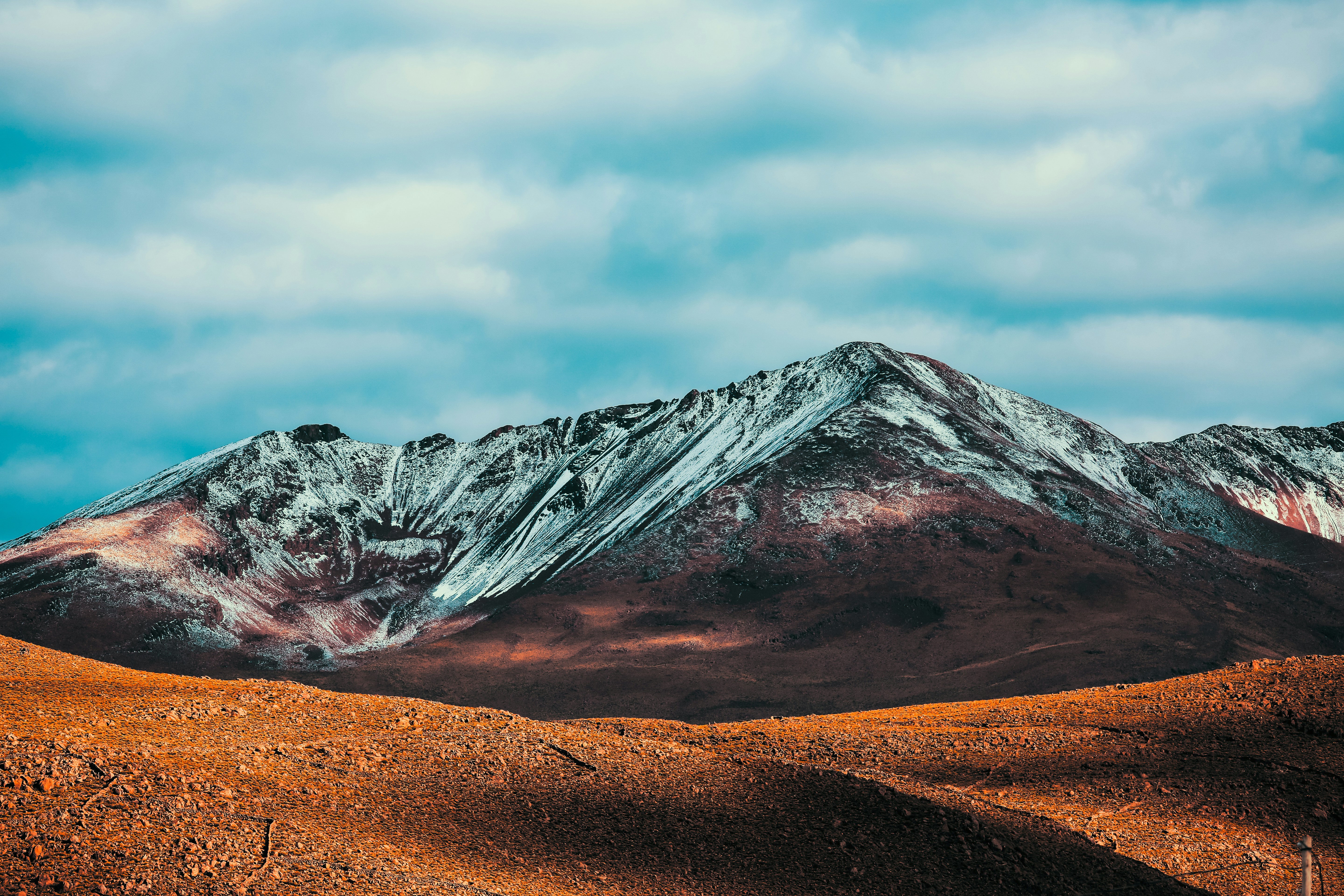 low angle-view of brown soil near mountain