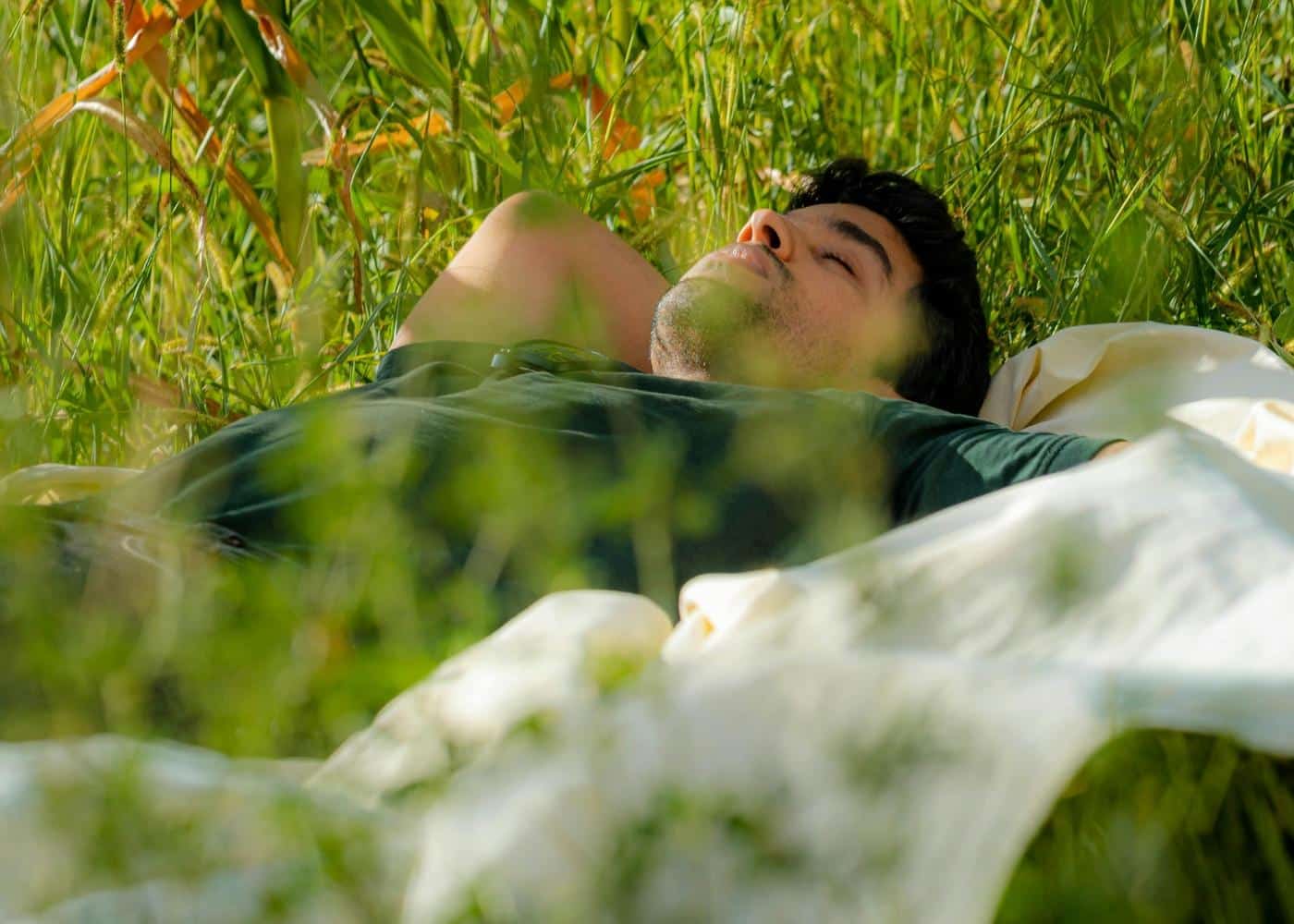 Good resting heart rate for a man - Man sleeping in a grassy field