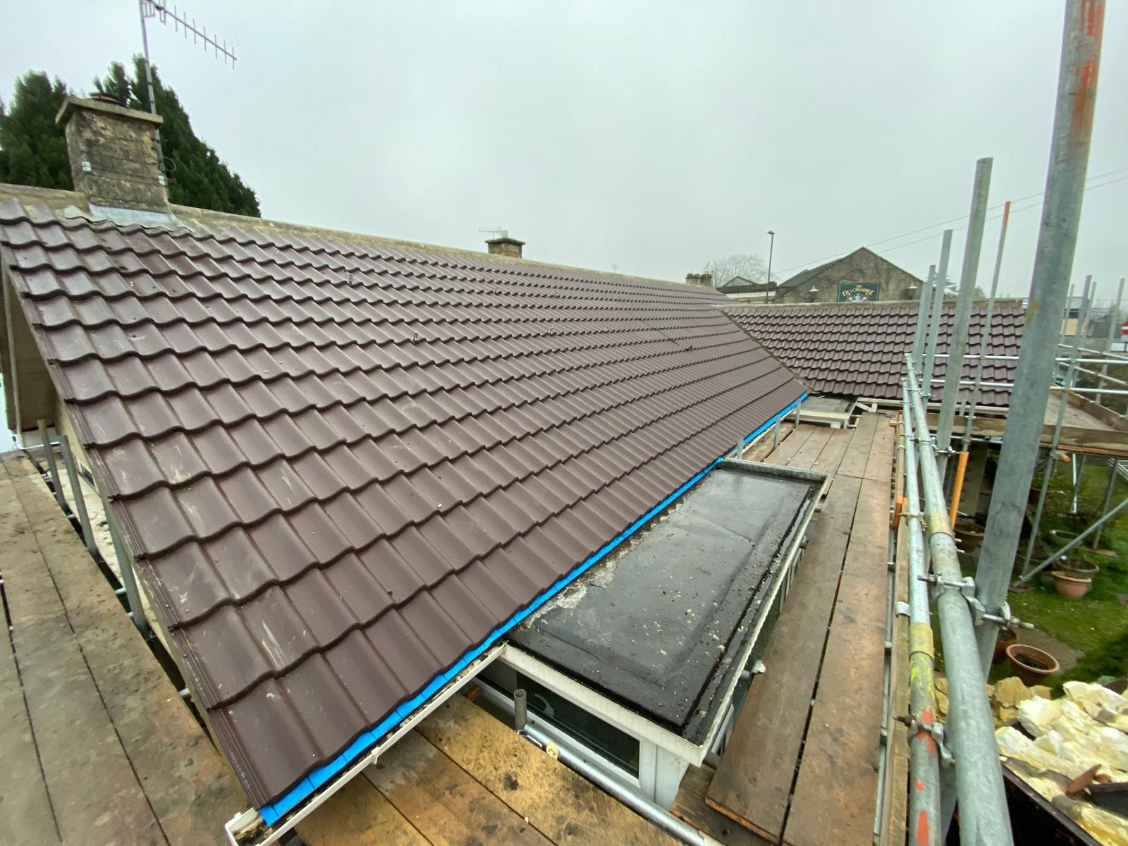 Finished tiled re-roof by SPL Roofing with the scaffold still up