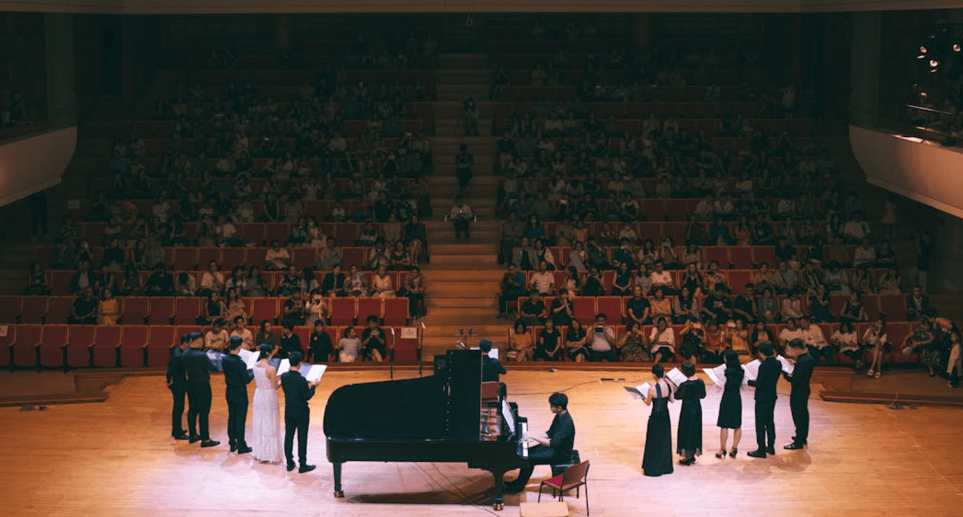 train on bridge surrounded with trees at daytime