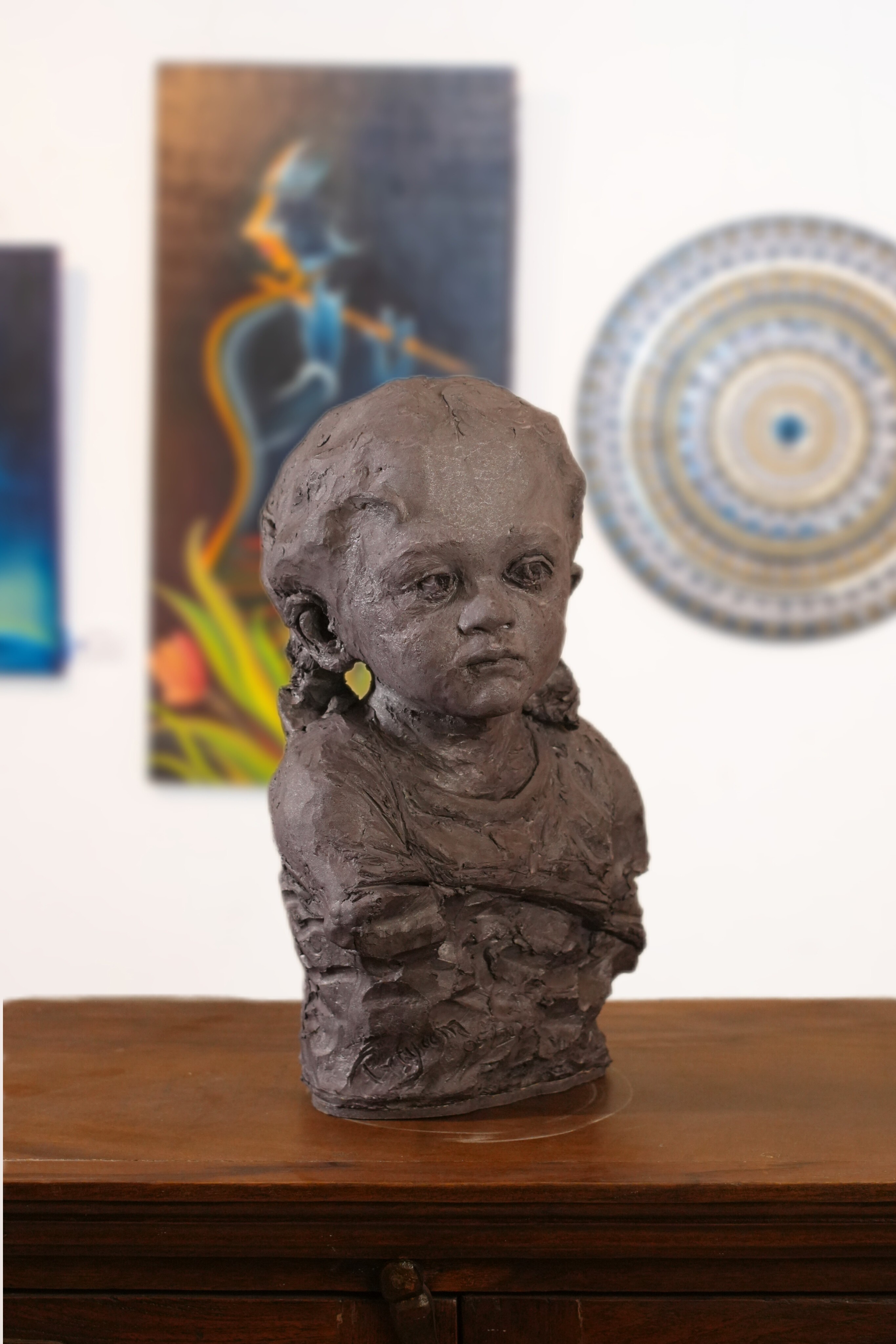 portrait sculpture of a young child