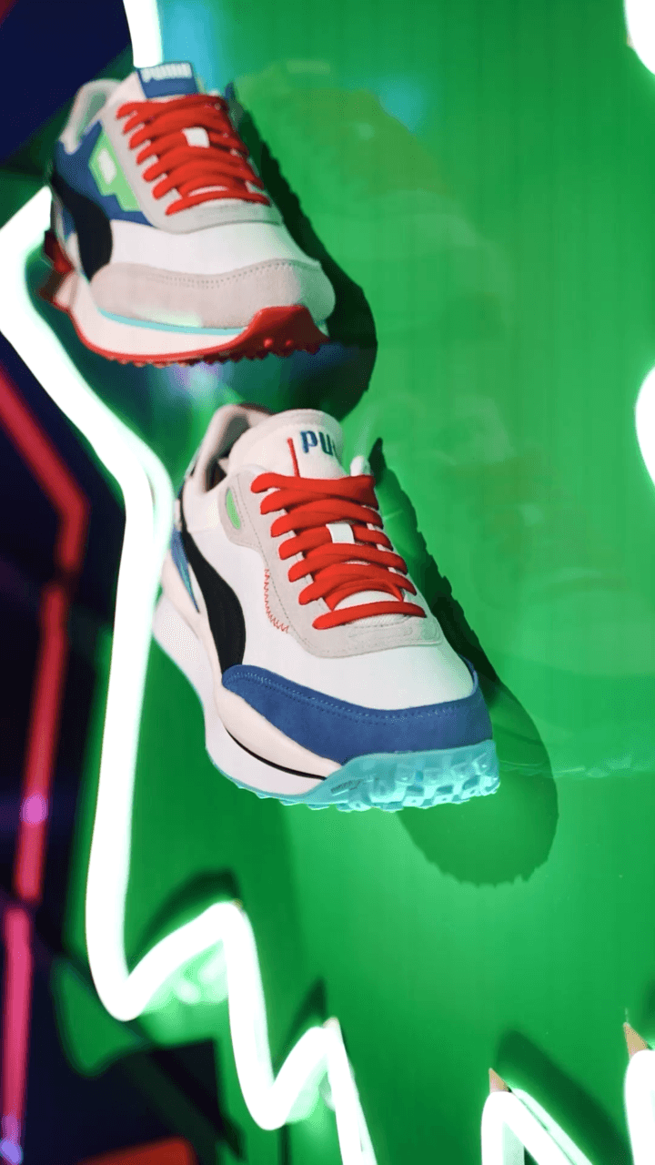 Puma's new shoes sitting on a green background