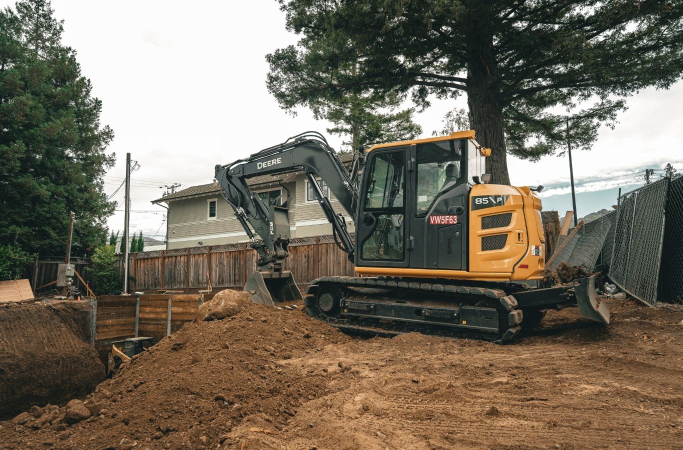 Lisac General Engineering team clearing overgrown land in Santa Clara County, CA with advanced machinery for efficient site preparation.