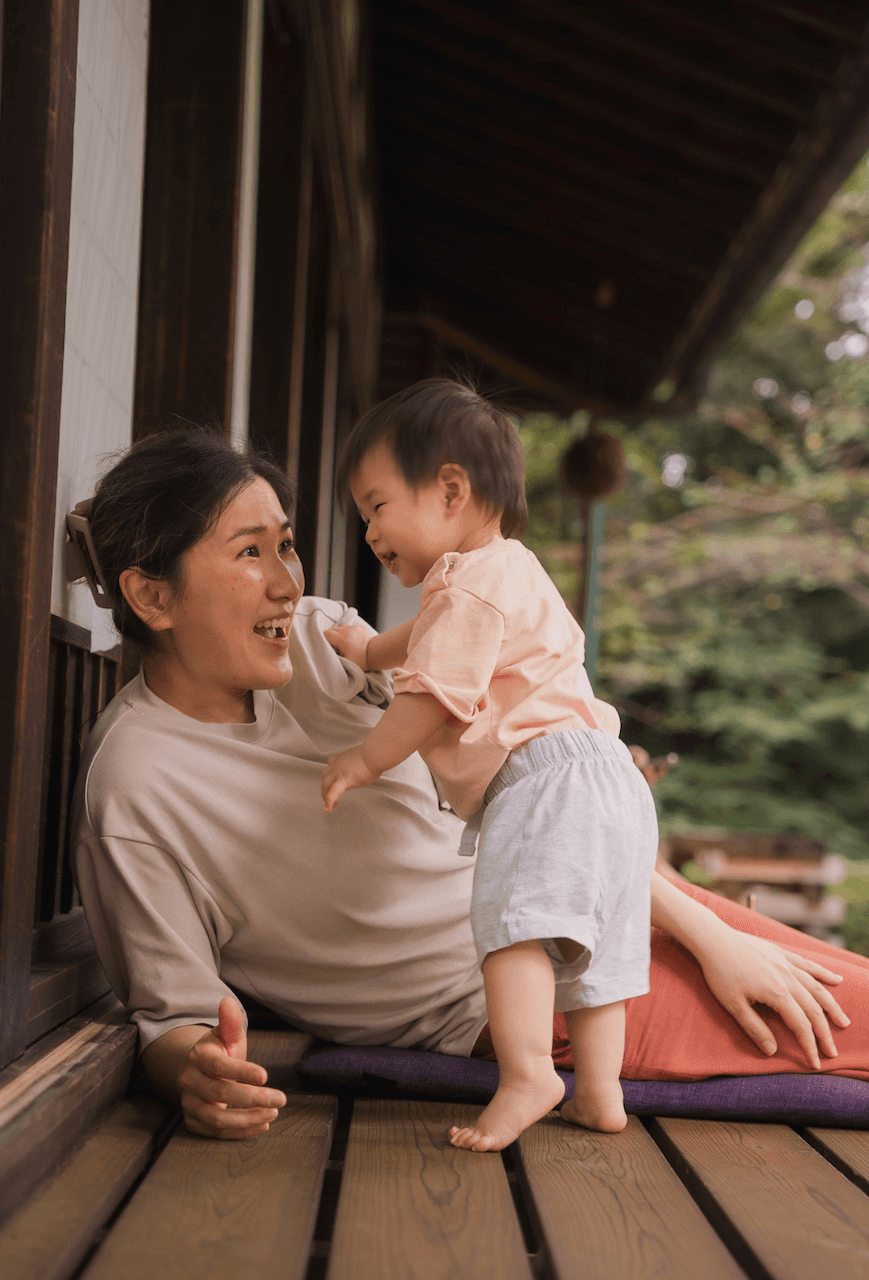 Mother and daughter in front of a traditional cafe