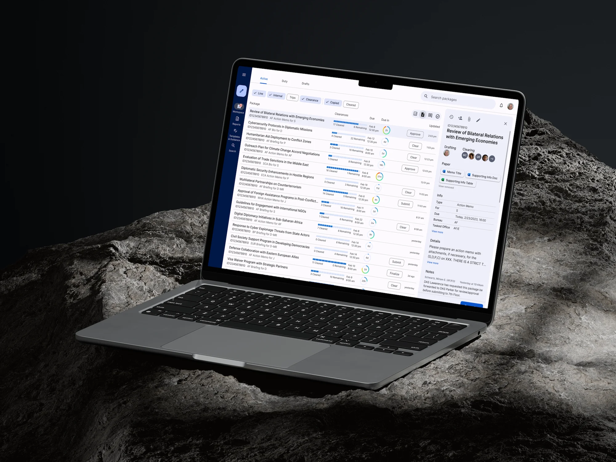 A laptop displaying a task management dashboard with a detailed list view, placed on a textured rock surface.