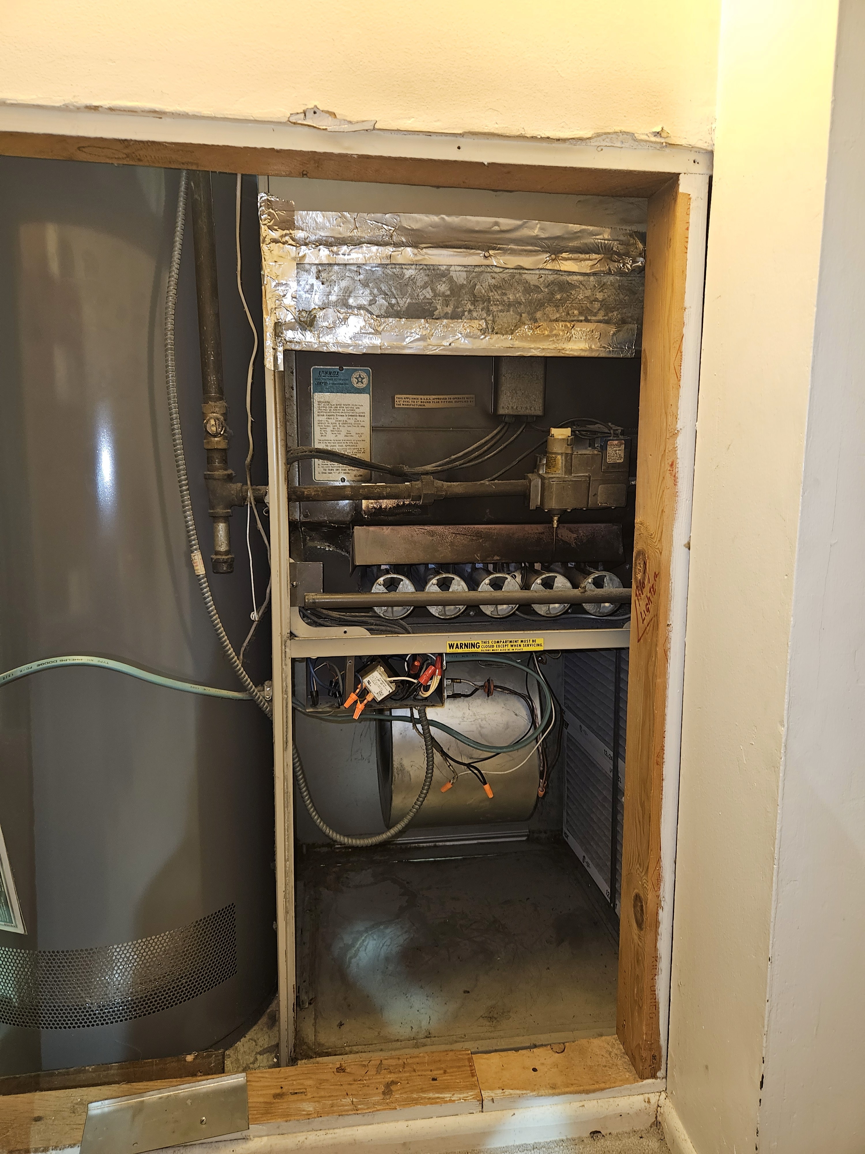 This is a Rheem outdoor air conditioner condenser unit. 