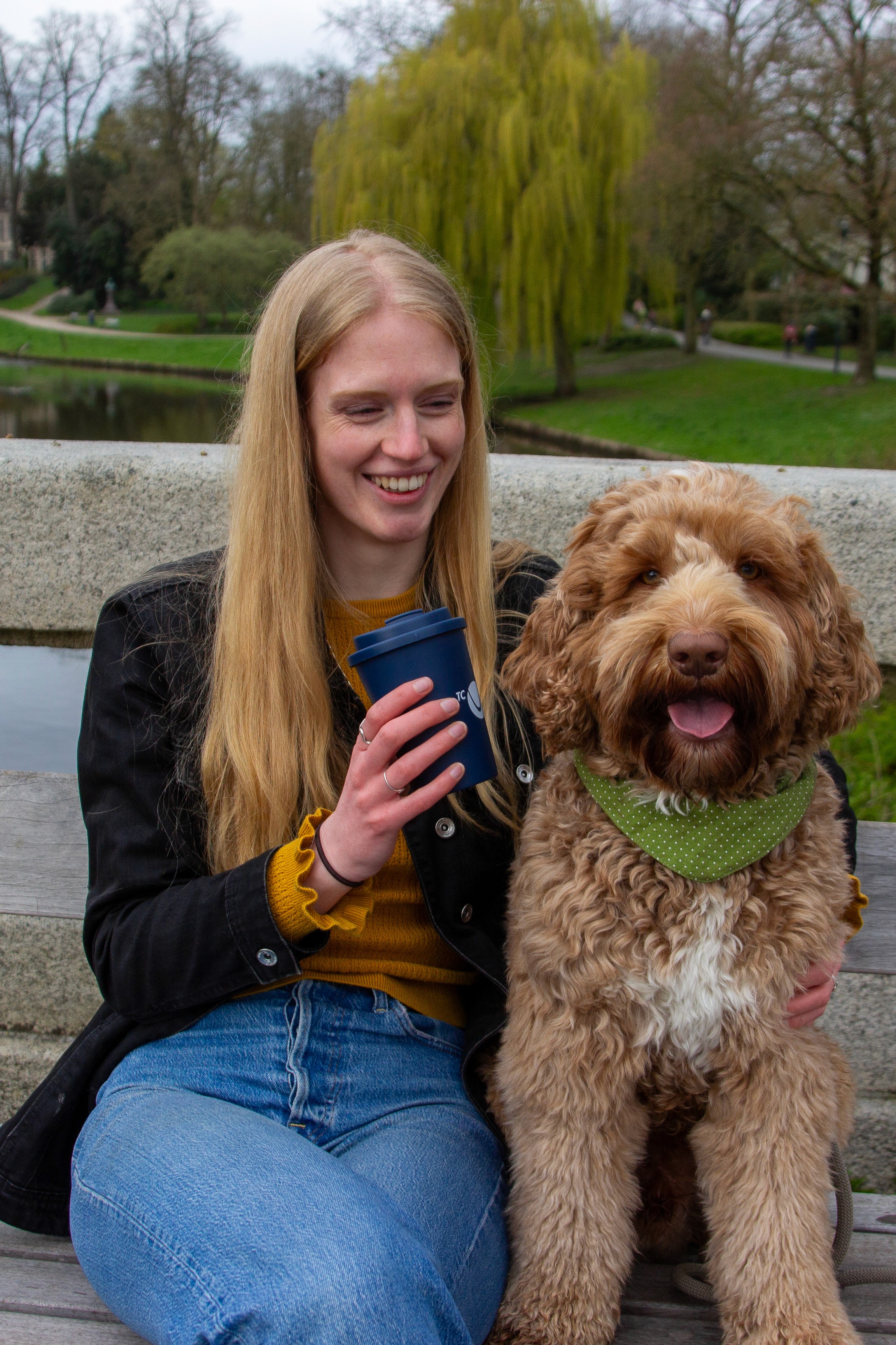 Pet sitter with dog on bench
