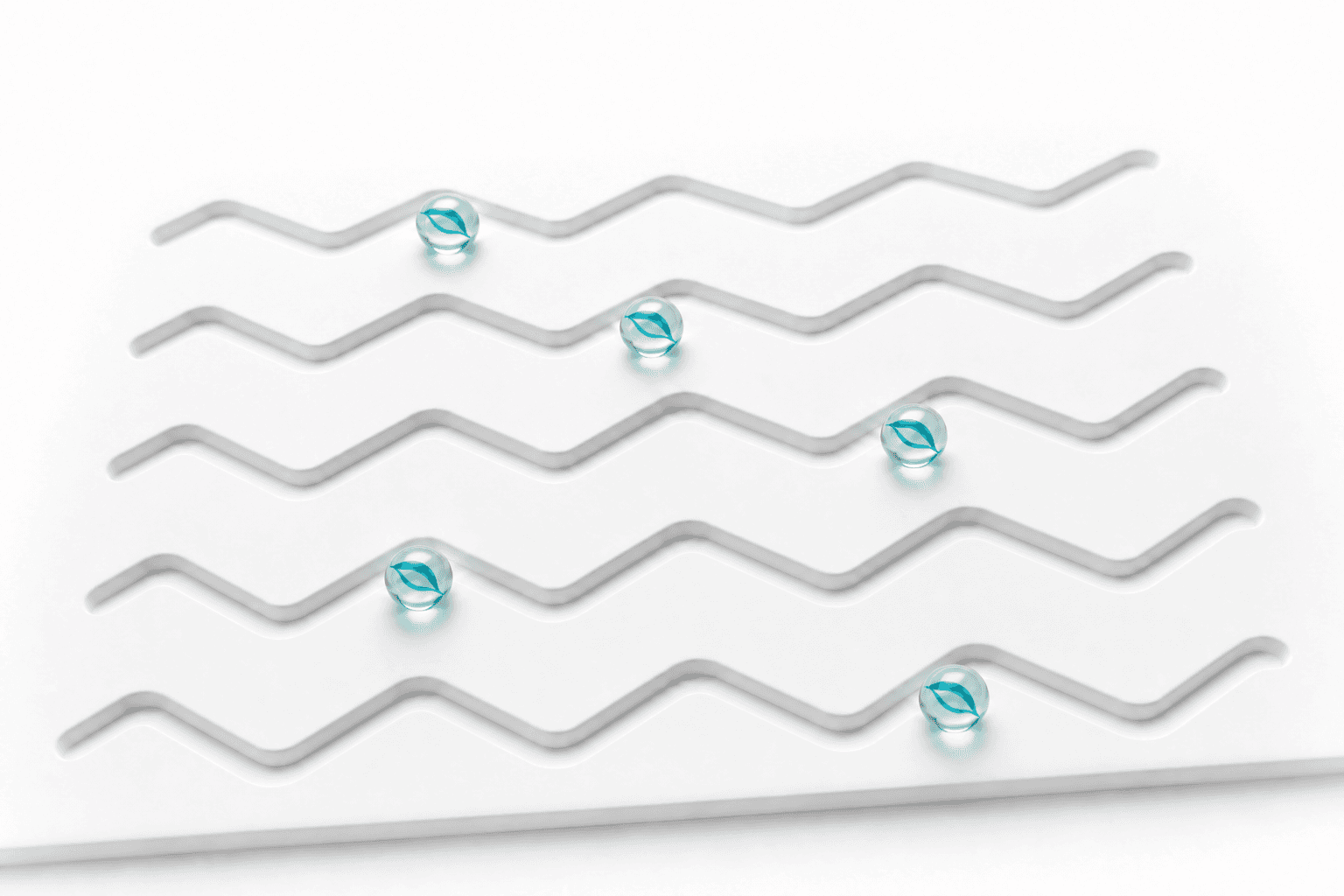 Five GoMarble agents travel through five parallel recessed zigzag grooves