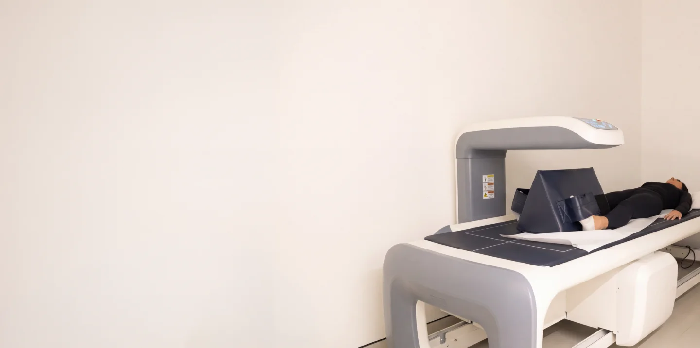Patient lying on a DEXA scanner