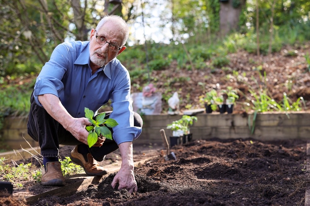 Bubjan with book and speaking to camera