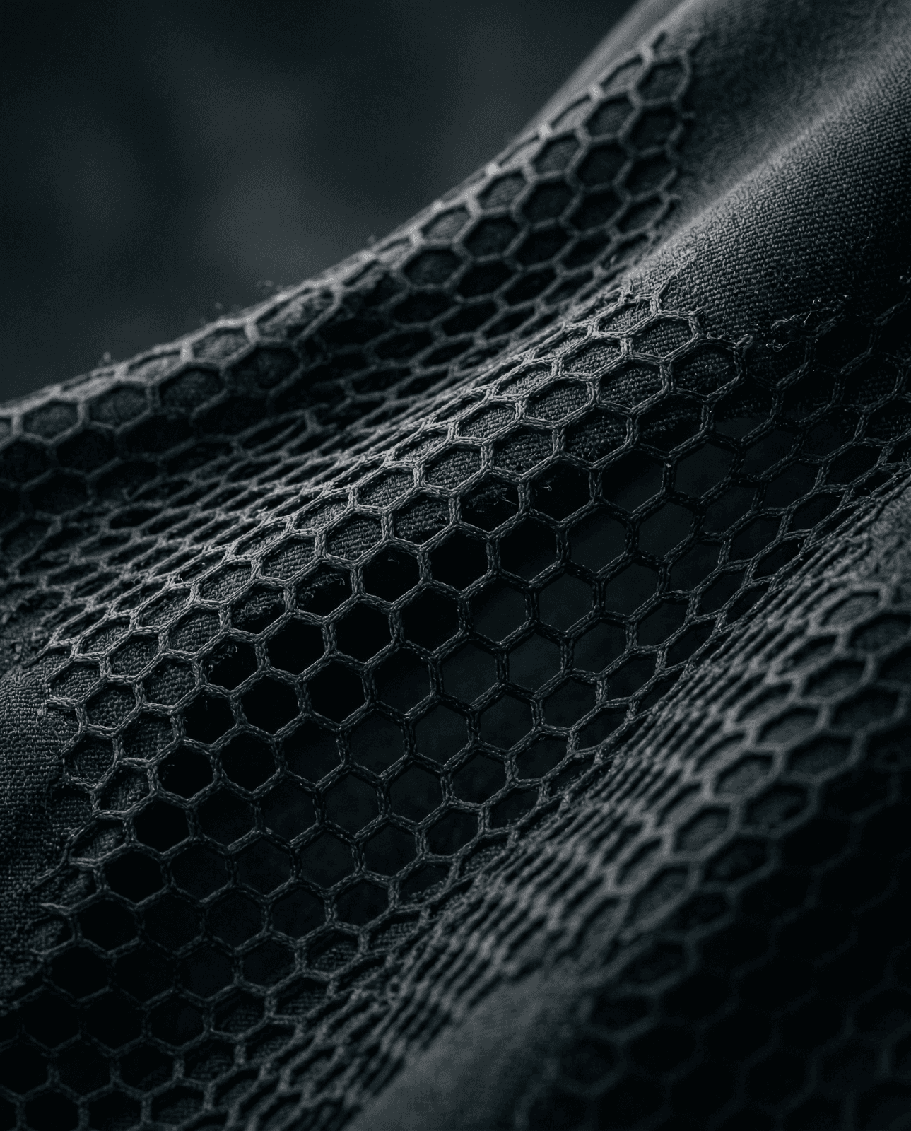 a stack of black paper sitting on top of a table