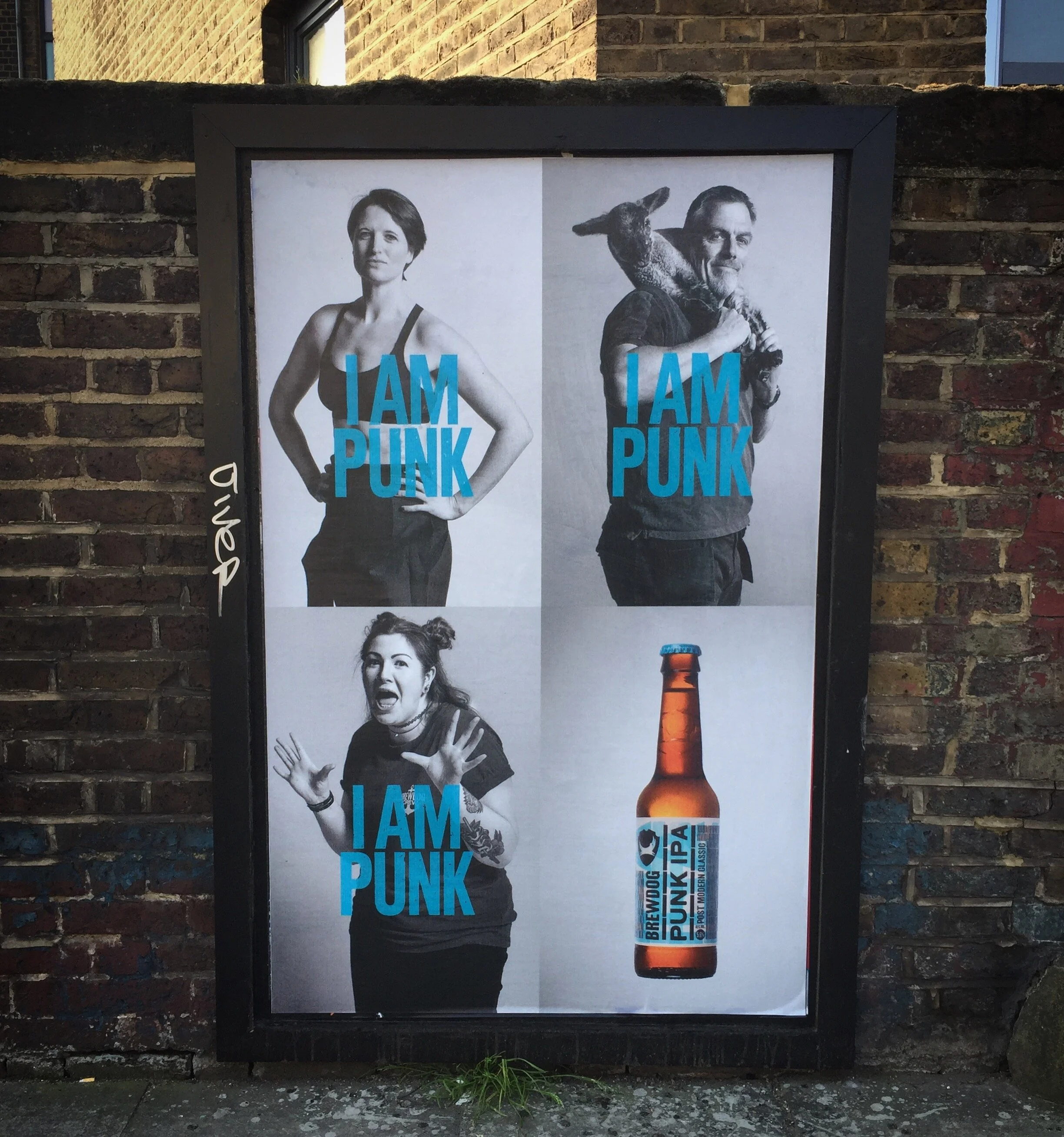 A close-up of a pink cocktail in a martini glass, set against a nighttime background with soft, blurred colors.