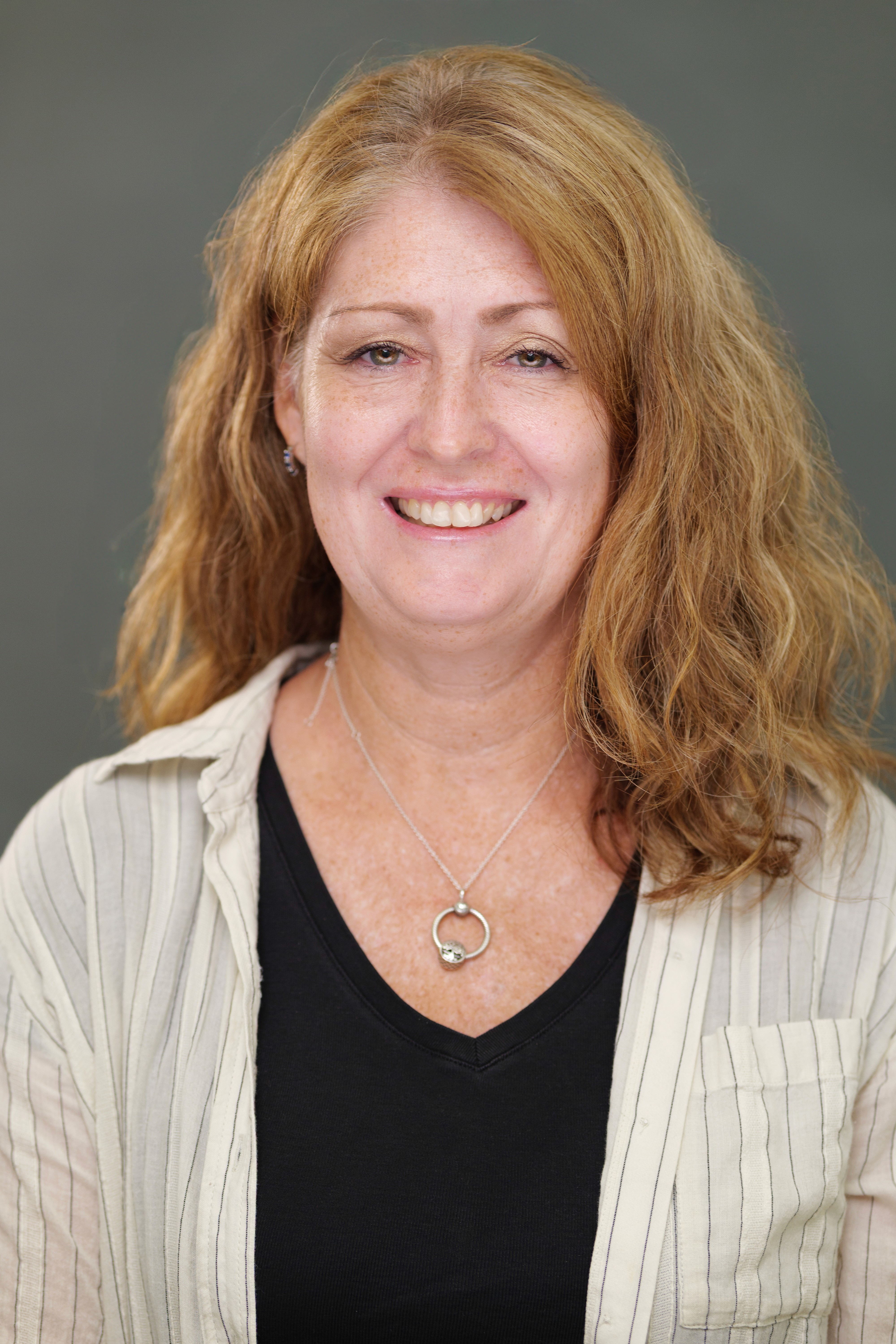 Teacher smiling in professional headshot in Claremont CA | FFotos