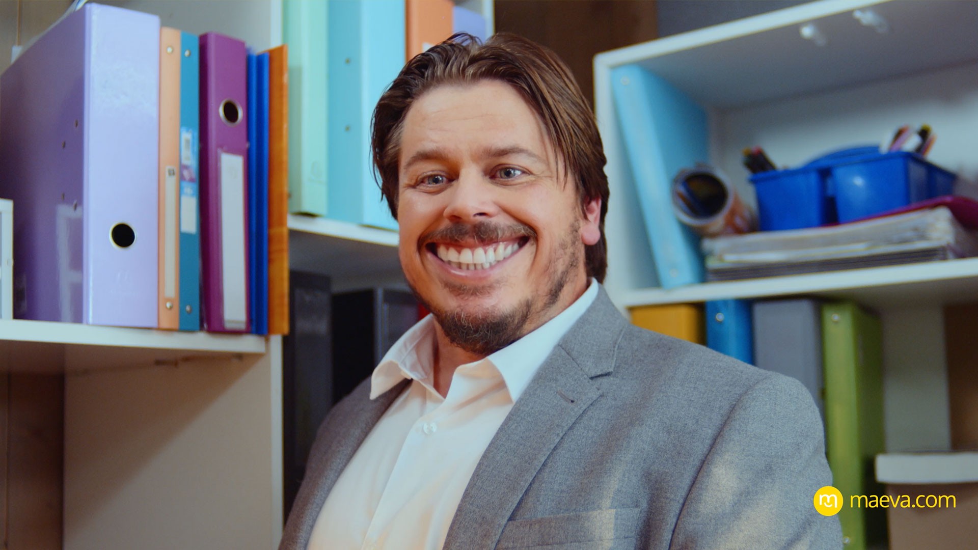 Woman wears a blue coat in a blue environment.