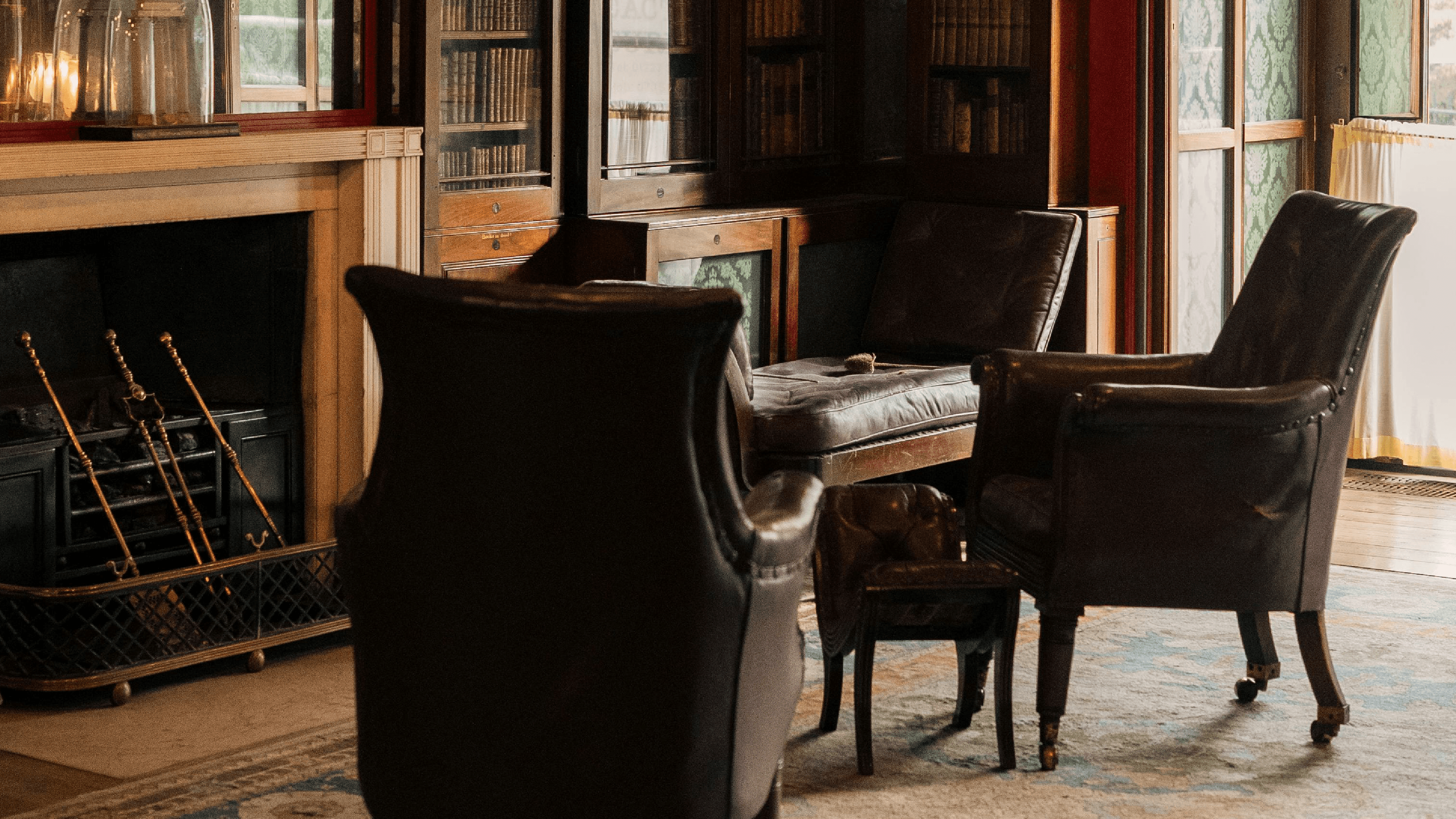 five black rolling chars front of desk