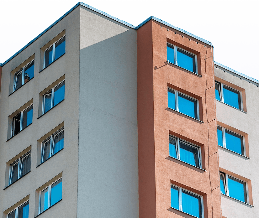 Apartment building exterior with multiple windows.