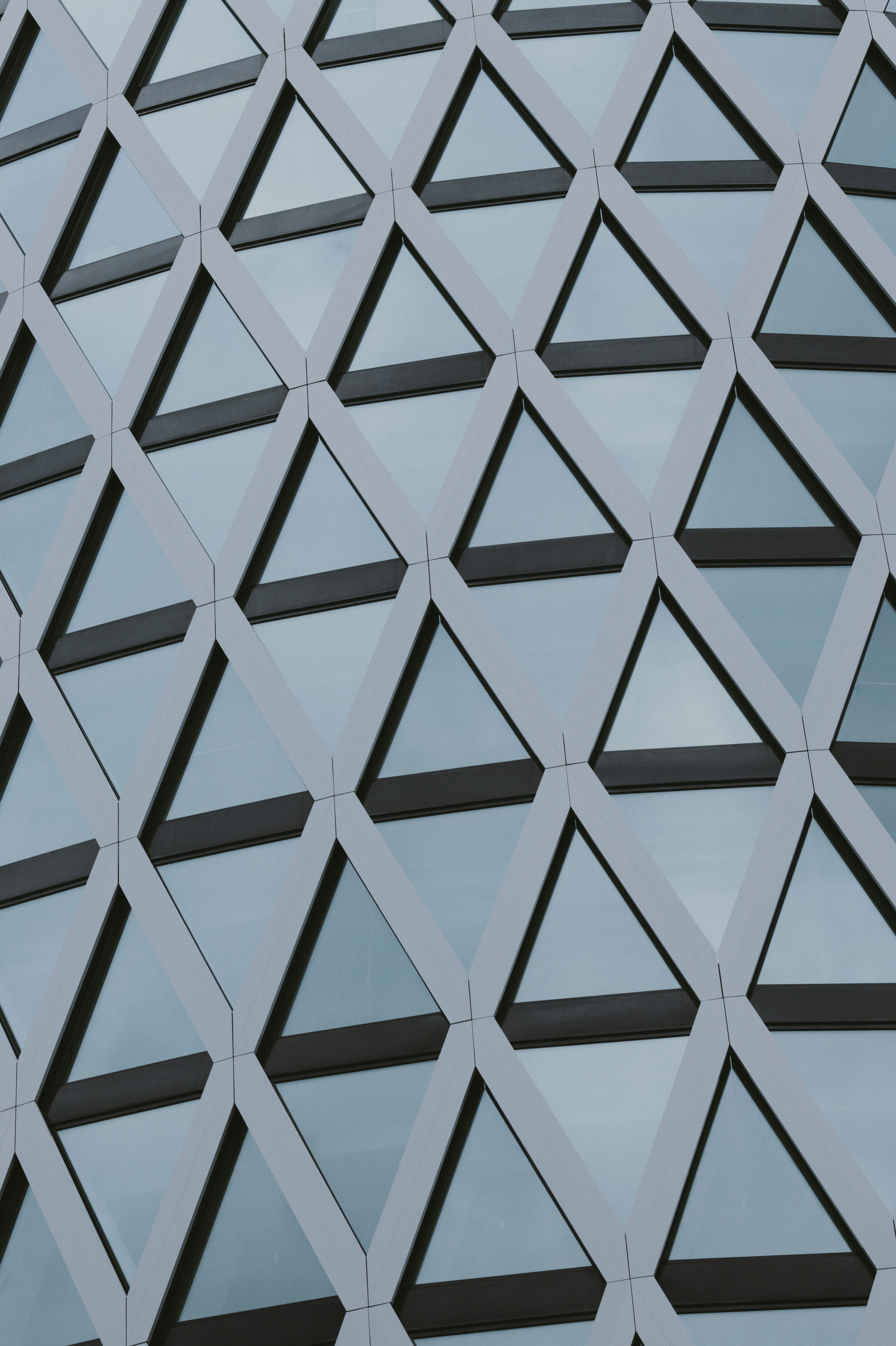Geometric pattern of triangular windows on a building