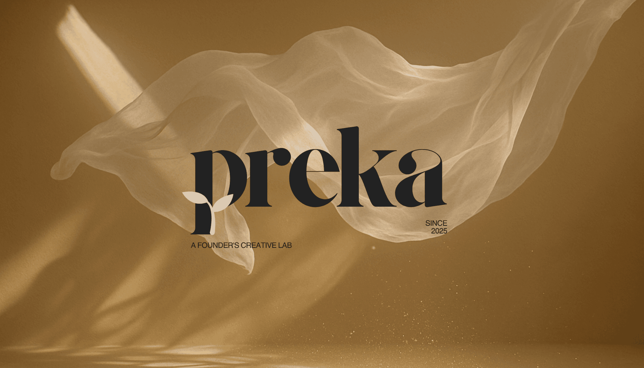 Abstract macro of a glass drop forming a black-and-white flower shape through light refraction on a soft gray background.